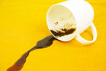 A spot on a light fabric, tablecloth, sofa. Washing, cleaning the fabric.の写真素材