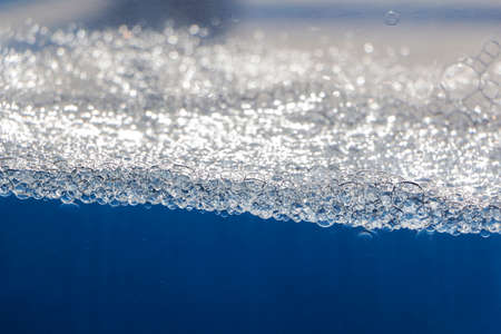 blue water with bubbles and blue drops background