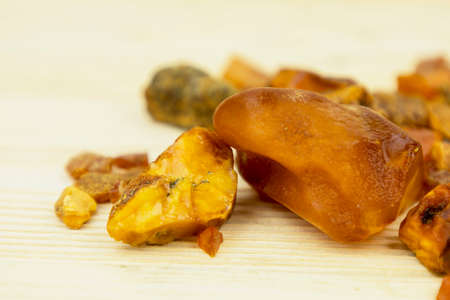 Amber. There are many different transparent pieces of amber, small and large, Ancient wood resin as a mineral for jewelers. The Sunstoneの写真素材