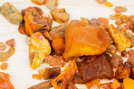 Amber. There are many different transparent pieces of amber, small and large, Ancient wood resin as...