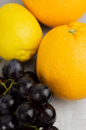 fresh fruits, lemon, orange, grapes on a light background. Close-up.の写真素材