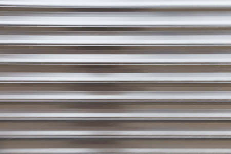 abstract background of horizontal stripes of metallic colorの写真素材