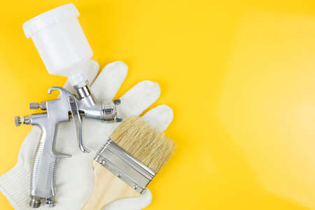 paint spray gun at work at the workplace in the workshopの写真素材