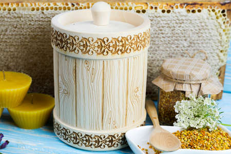 Wooden barrel with honey and other bee products, wax, bee pollen