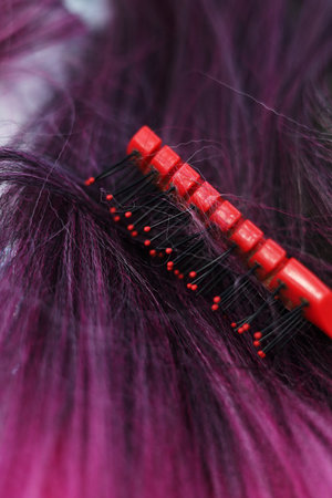 comb on the background of hair, the process of creating a hairstyleの写真素材