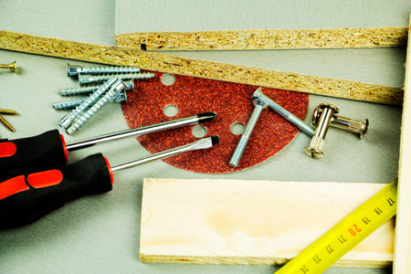 Furniture fittings. Furniture assembly hardware options and tools on a white background. Large...