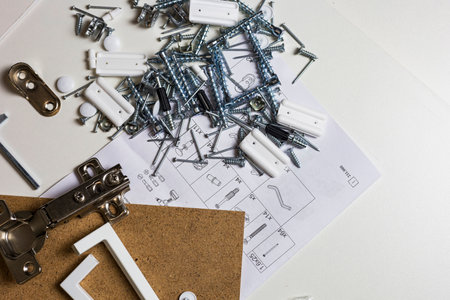 Furniture fittings. Furniture assembly hardware options and tools on a white background.の写真素材