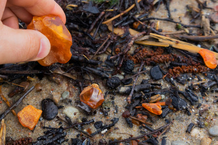 Beautiful pieces of amber in your hand. A glowing wavy piece of amber on your palm. The sunstone.