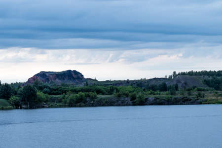 Landscape, view of the other side of the pond. The photo was taken near the town of Kopeisk, Chelyabinsk region, Russia.の写真素材