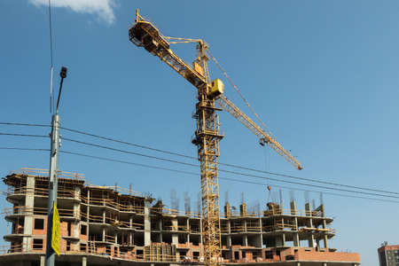 Crane and construction of a new house.のeditorial素材