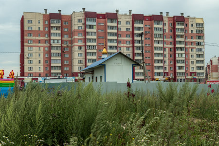 The parish of the Church of the Presentation of the Lord against the backdrop of residential buildings.のeditorial素材