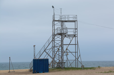 Metal tower of the coast guard on the beachの写真素材