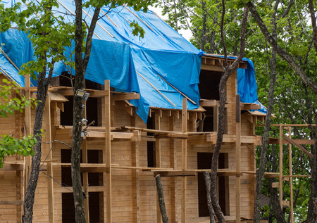 Wooden house under construction in the forestの写真素材