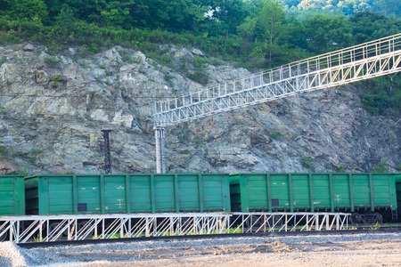 Freight cars on a rail near steep slope. Summer dayの写真素材