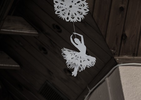 Paper decor in the form of a ballerina hanging under the ceil. Hand made decoration.の写真素材