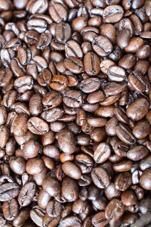 Roasted coffee beans. Top view. Vertical orientationの写真素材