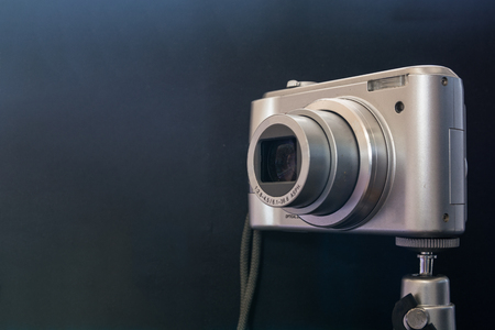 Silver compact digital photo camera. Side view.の写真素材