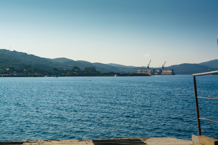 View from ferry on the shipyard. Summer day.の写真素材