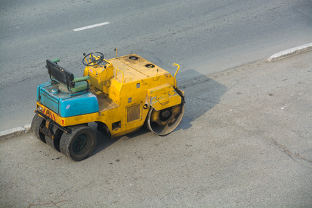 Yellow Asphalt Compactor. Industrial Mashin at Street.の写真素材