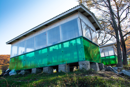Long pavilion based on cement blocks. White-green gazebo.の写真素材