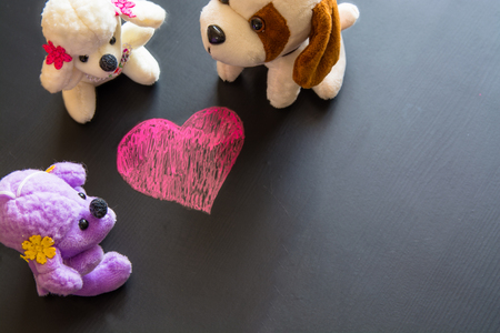 Soft plush toys around sketch of heart. Symbol of valentine's day.の写真素材