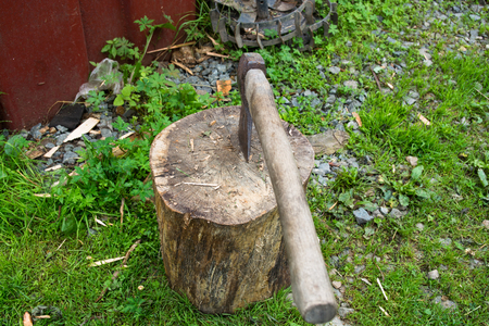 Axe in log. Close-up of axe handle.の写真素材