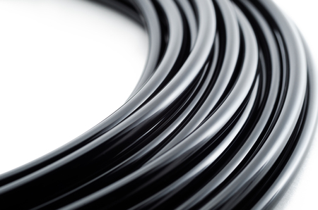 Black wire bundle macro photo with white backgroundの写真素材