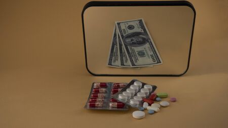 antiviral drugs are reflected in the mirror as money