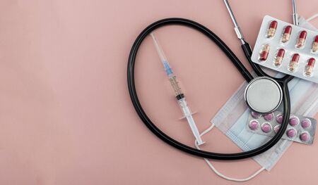 medical preparations with a mask on a pink background, isolatesの写真素材