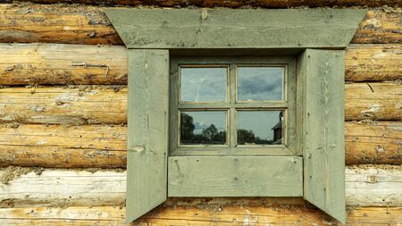 wooden window of an old peasant hutの写真素材