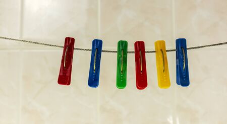 colorful clothespins on a rope in the bathroom