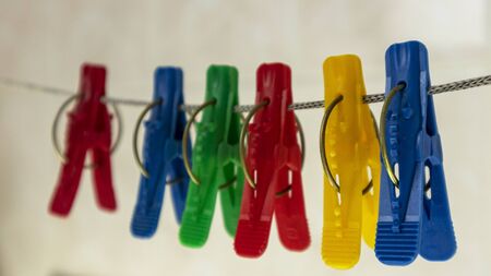 colorful clothespins on a rope in the bathroom