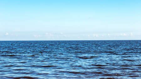 blue seascape on a Sunny day with the sky on the horizonの写真素材