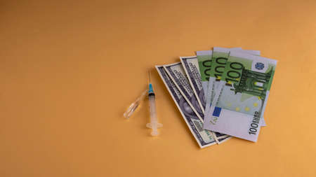 medical mask ampoule with vaccine syringe idollars on peach background