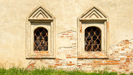 old monastery windows with iron bars, backgrounds