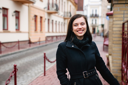 portrait of young attractive cheerful woman walking in city, lifestyleの写真素材