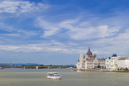 Parliament of Hungary with the Danube river and the blue skyの写真素材
