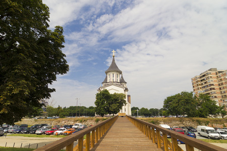 The bridge and the Orthodox Episcopal Cathedral, Resurrection of Oradea, Romaniaの写真素材