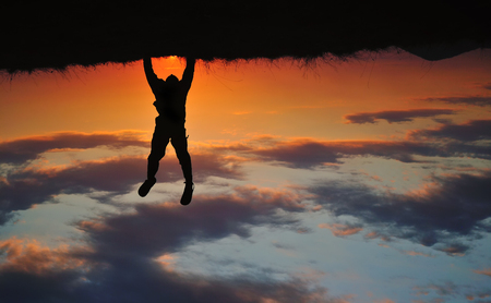 Boy silhouette hand-standingの写真素材