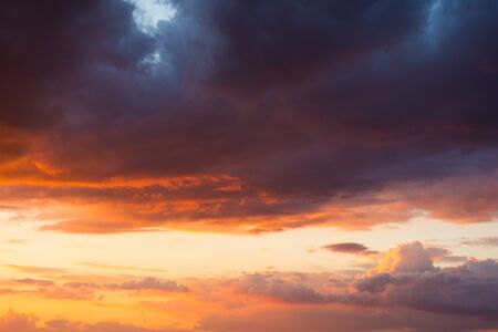 Storm clouds at sunset in bright colors