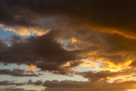 Storm clouds at sunset in bright colors