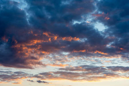 Colorful sunset clouds with fiery red cloud