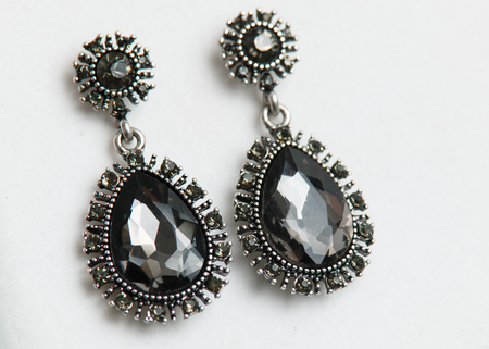 Silver earrings isolated on white background shot in studioの写真素材