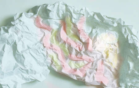 Photo crumpled paper in the shape of a girl twirling in a danceの写真素材