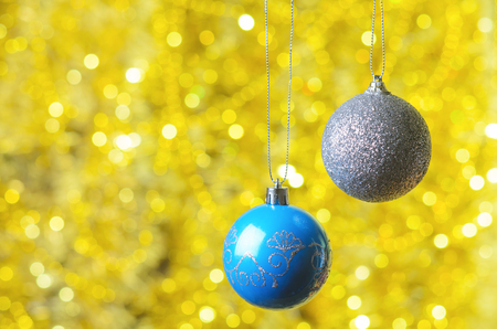 Christmas balls on an abstract background bokeh. New Year decoration on the glittering background.の写真素材