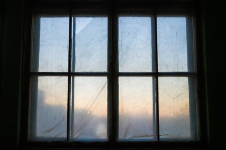 Old wooden windows, free space. Dirty windows clogged with oilcloth.の写真素材