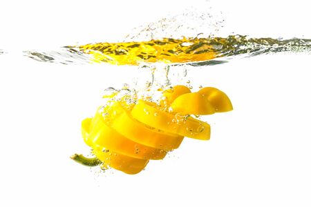 Sweet yellow pepper slices Isolated on a white background. Healthy eating concept.の写真素材