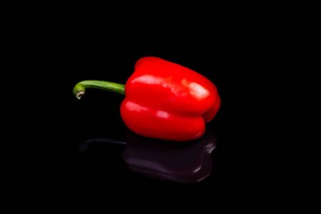 Red paprika isolated on black background. Vegetable.の写真素材