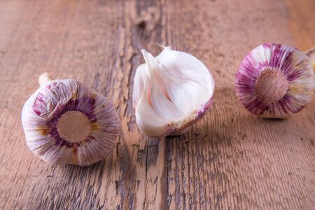 garlic, green, young, on wooden backgroundの写真素材