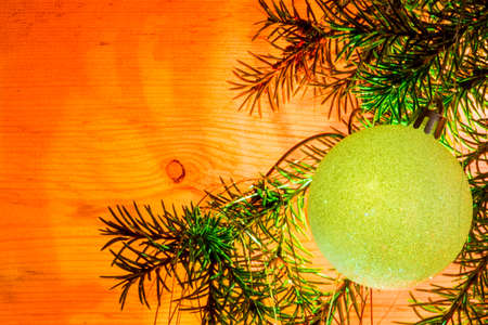 New year greeting card with your text. Christmas decoration from a tree branch, glass multicolored...